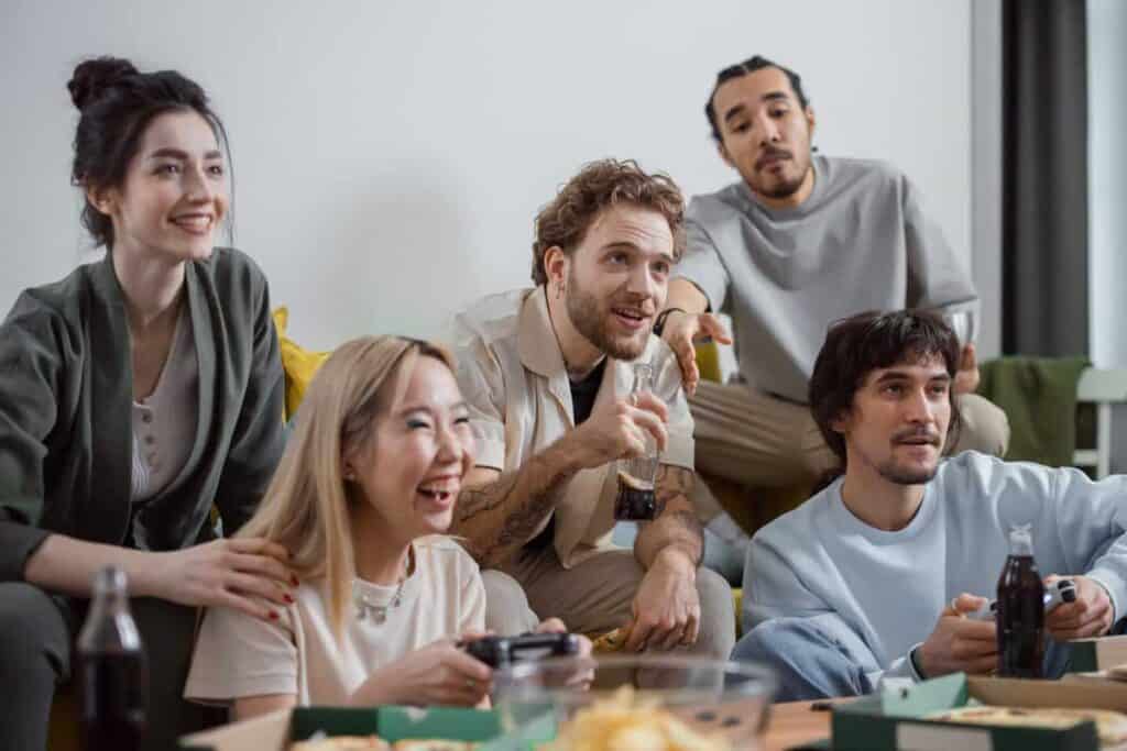 five friends watching TV together