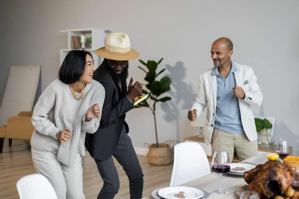 Group of people dancing in home