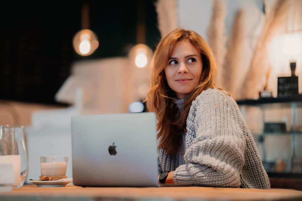 a woman with her laptop looking at something