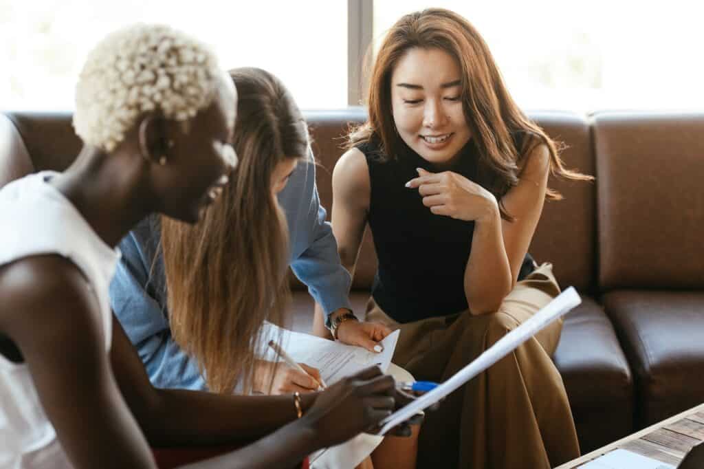 three women in a discussion