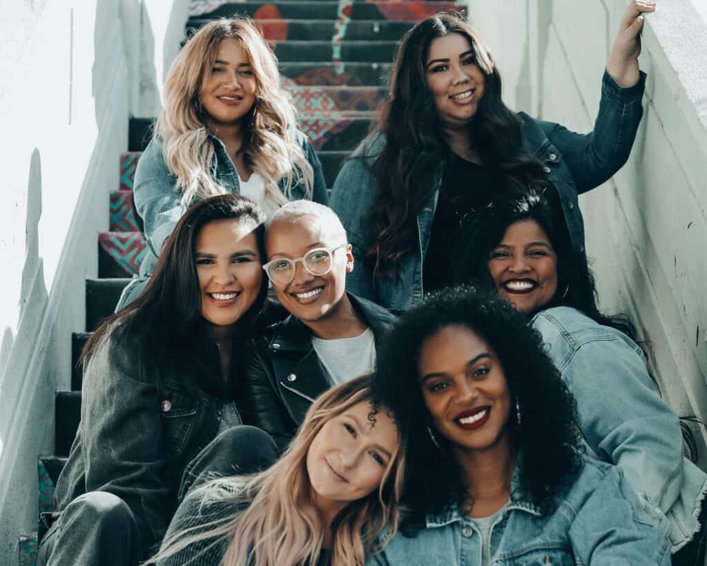 Girls Smiling Together Outside in The City on A Staircase