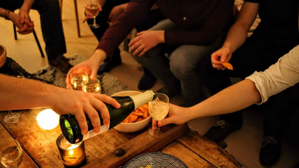 Roommates Having Dinner Together Around the Table