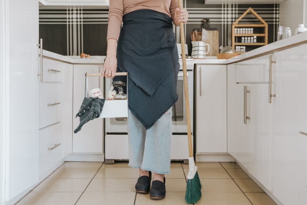 Woman with cleaning materials