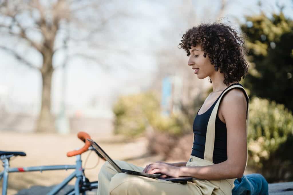 woman working on her laptop outdoors