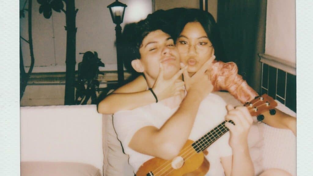 Boy and Girl doing crazy on the sofa while hugging