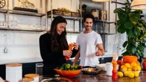 Girl and boy cooking dinner together