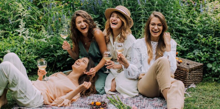 Rommates having a picnic together and enjoying themselves.