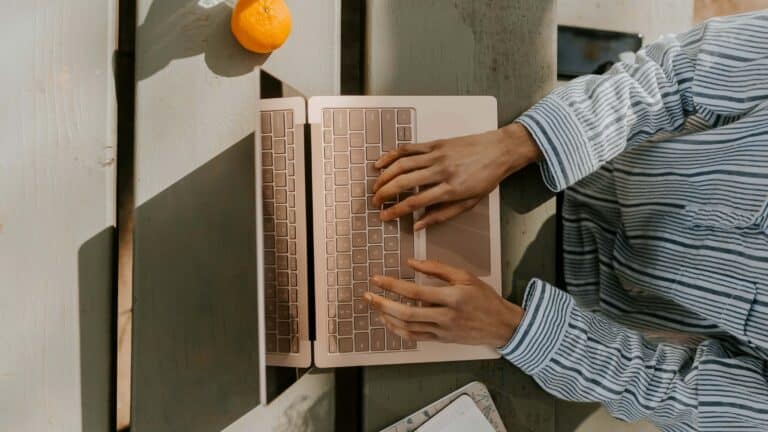 Person typing on laptop