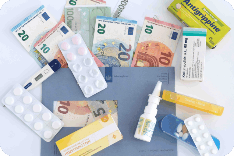 Medications and euro banknotes surrounding a Belastingdienst envelope