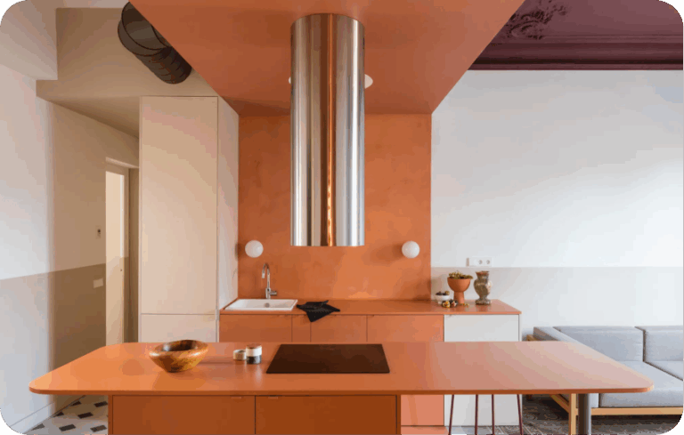 Vibrant orange kitchen with a statement ceiling and sleek finishes