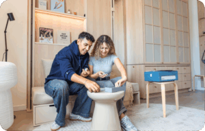 Couple playing a game together in a cozy, minimalist apartment